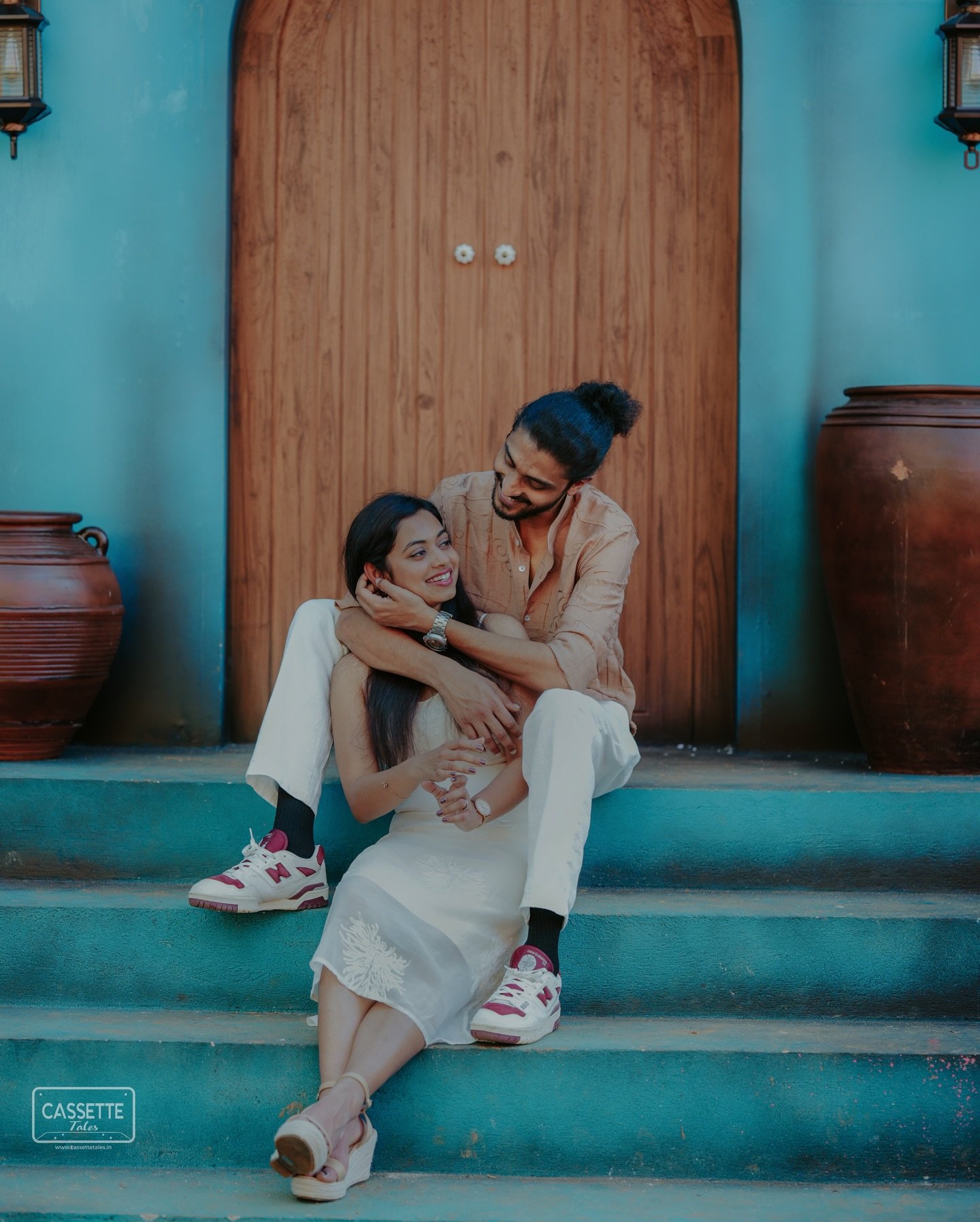 A couple sharing a relaxed moment together on colorful steps