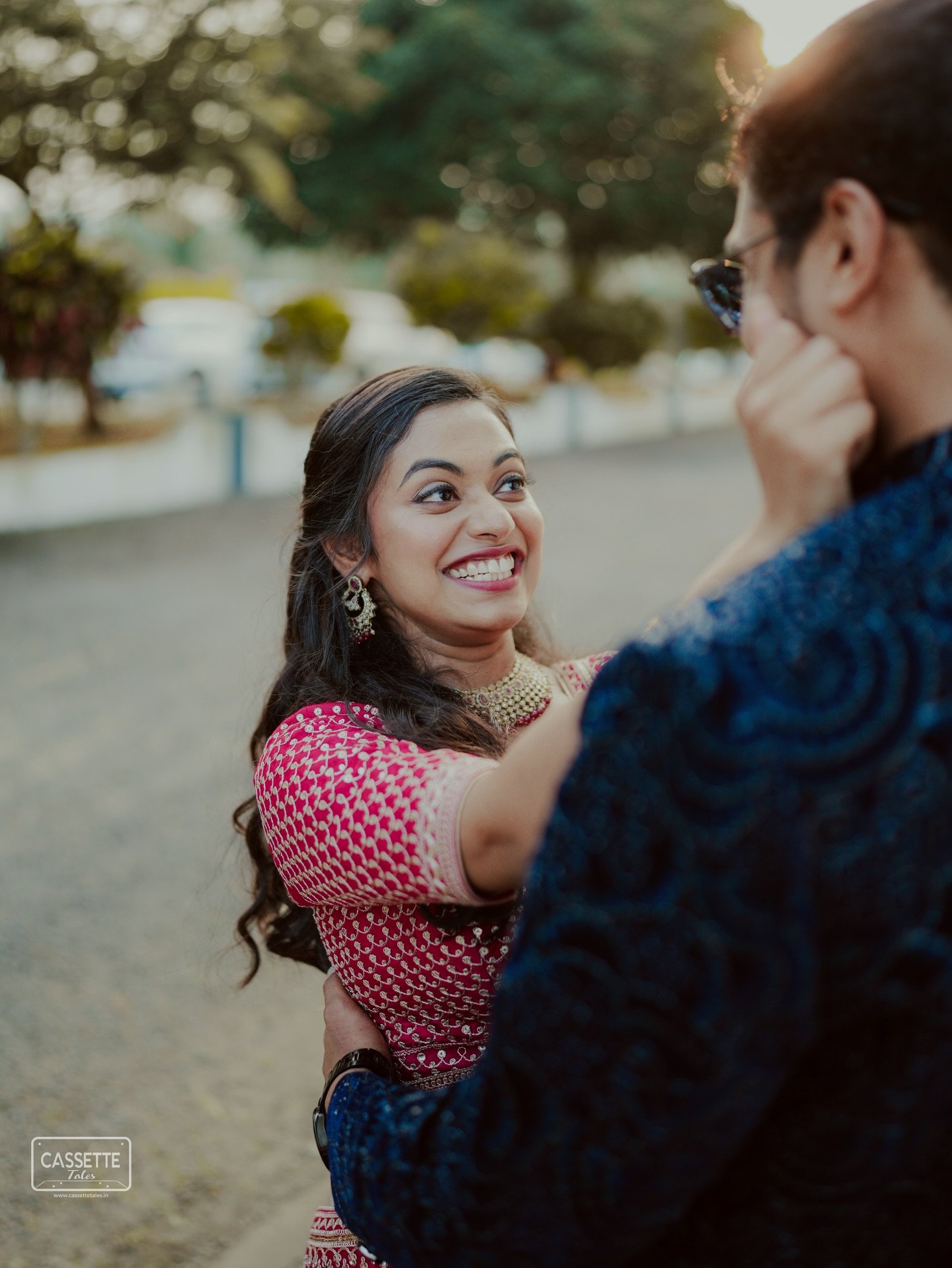 A bride smiling joyfully at her partner