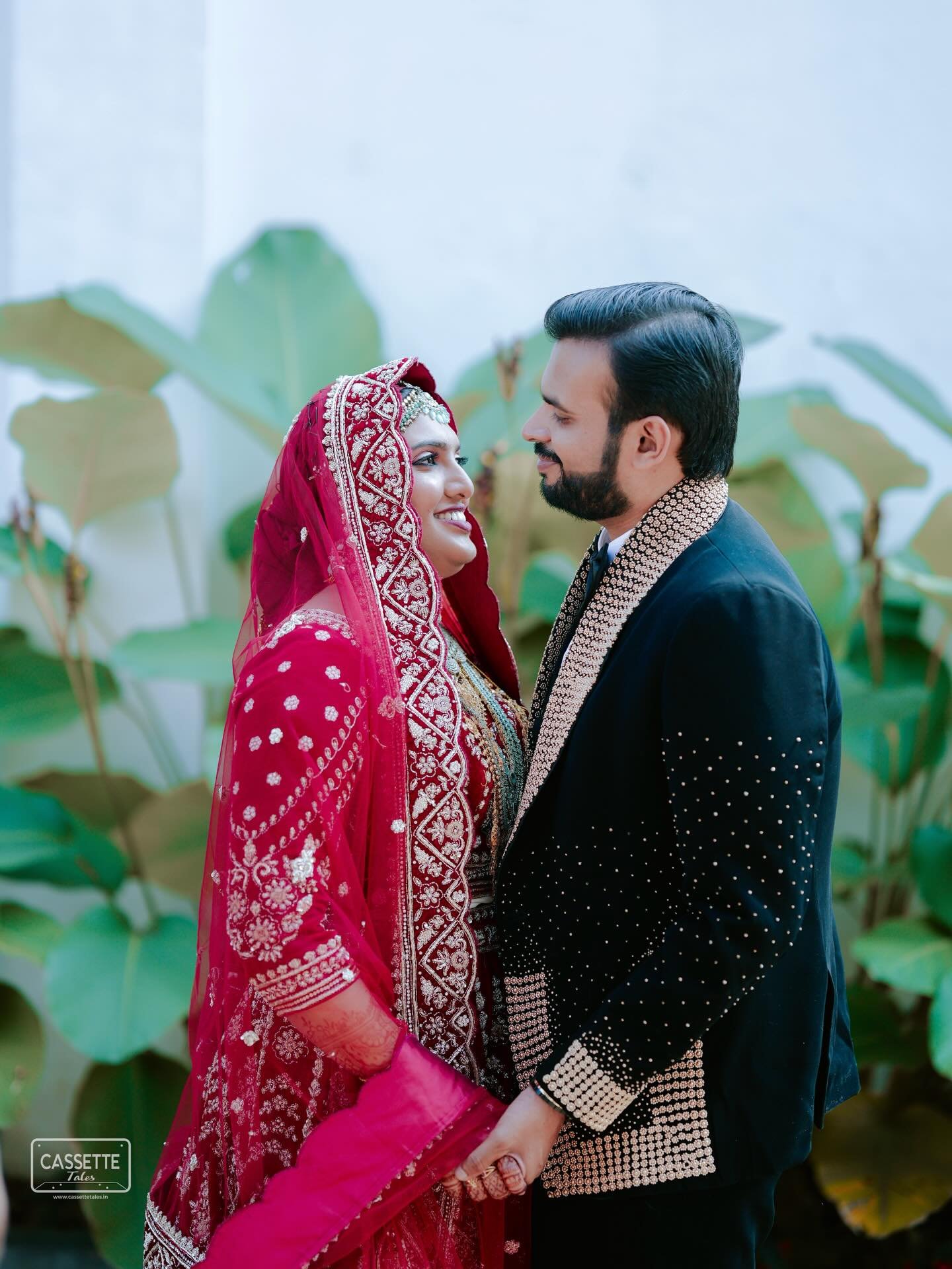 A newlywed couple looking into each other's eyes